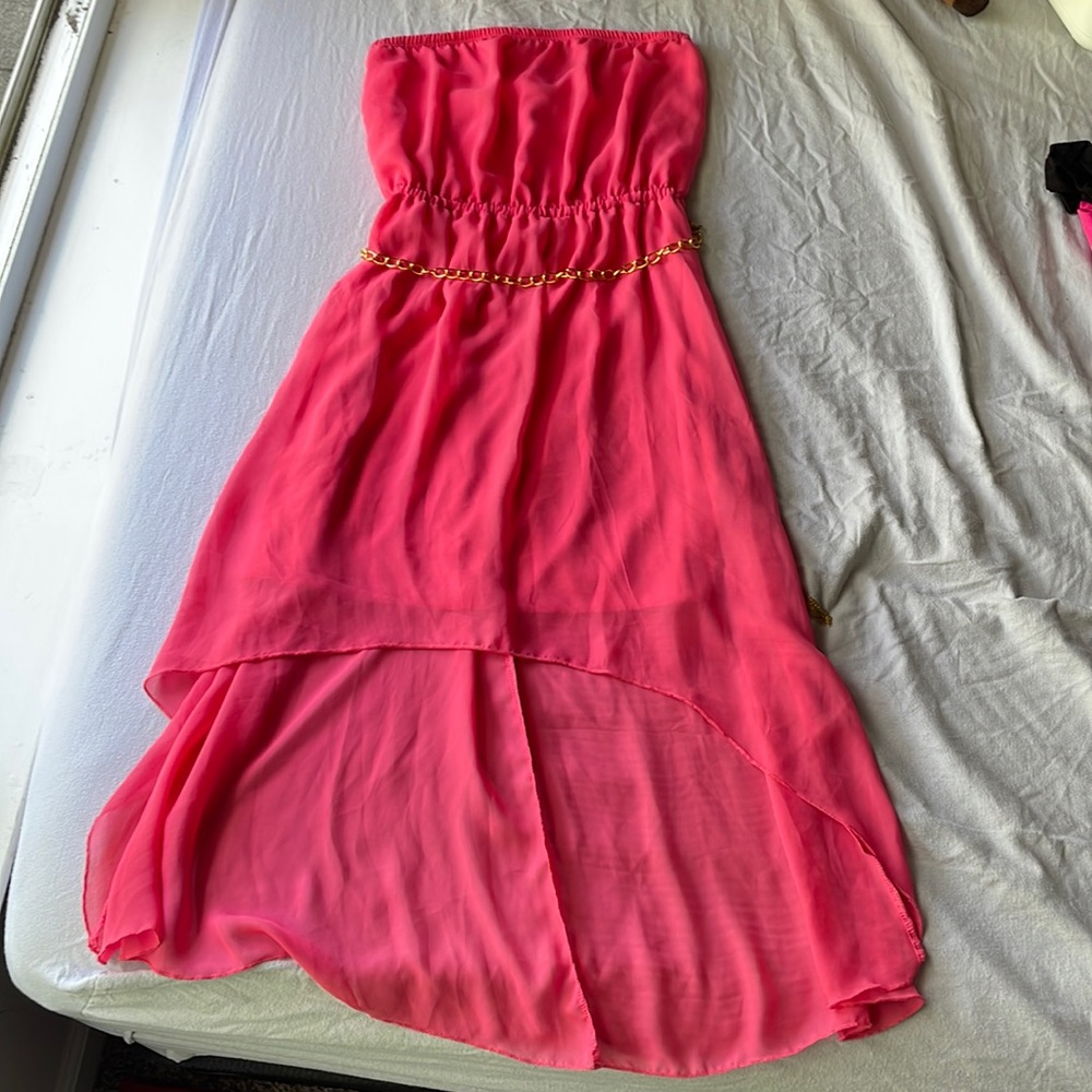 A hot pink dress with golden chain